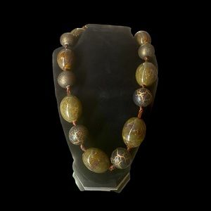 Stunning, natural stone individually nodded with beautiful ribbon necklace.
